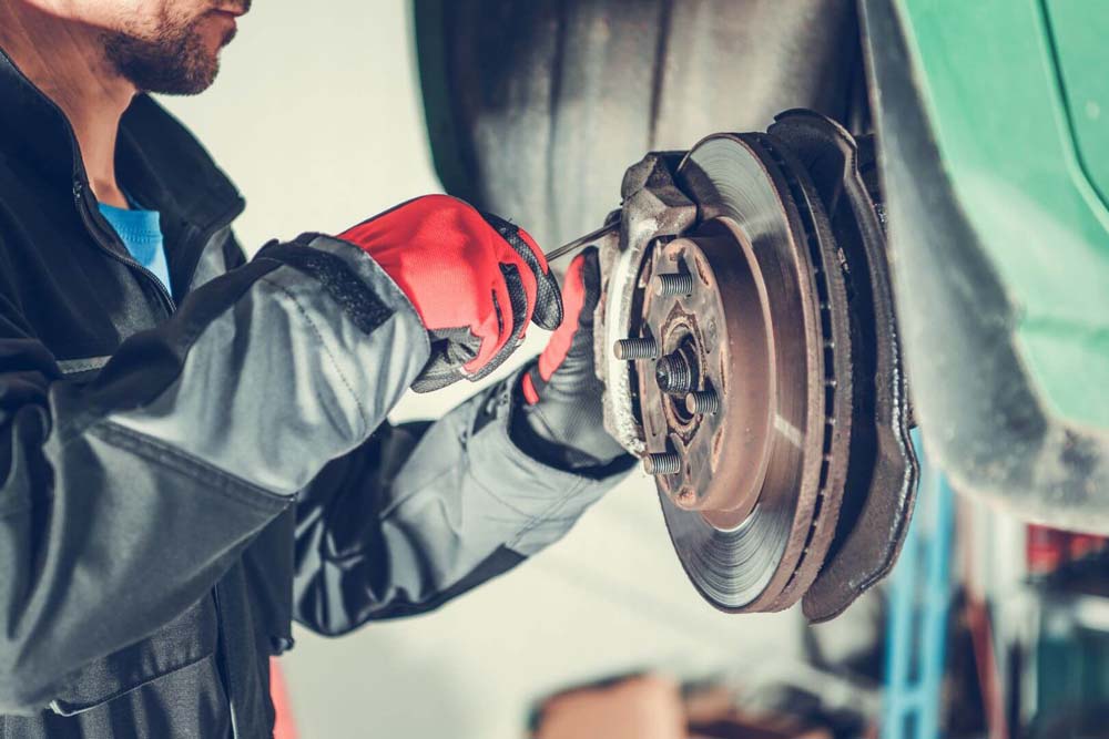 Brake specialist doing brake service