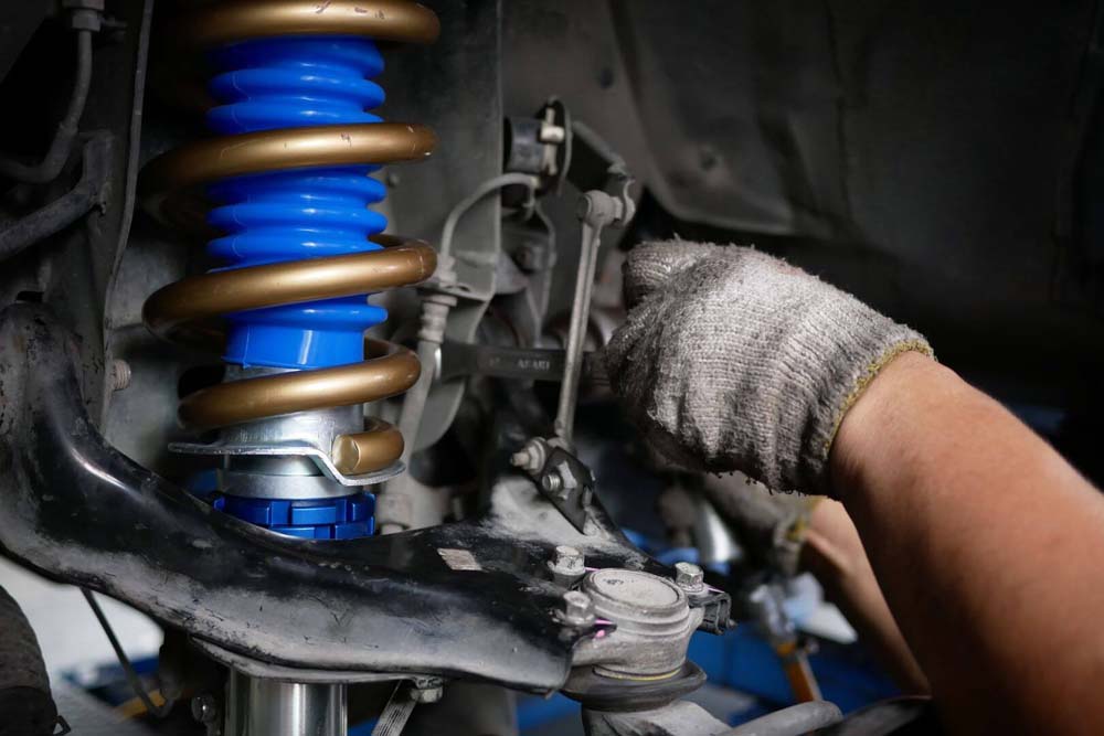 Car undergoing shock absorber testing process